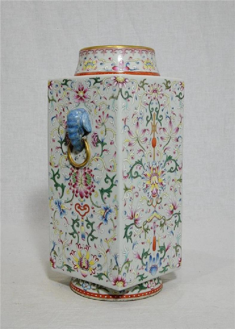 Chinese Famille Rose Porcelain Square Vase With Studio: Chinese famille rose porcelain square vase, decorated with elephant heads around by flowers . Six red Chinese character studio mark on the base. Good condition. 13" height.