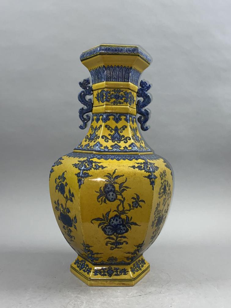 Chinese Qing Dynasty Qianlong period yellow glaze blue and white double-ear vase. (1 of 7)