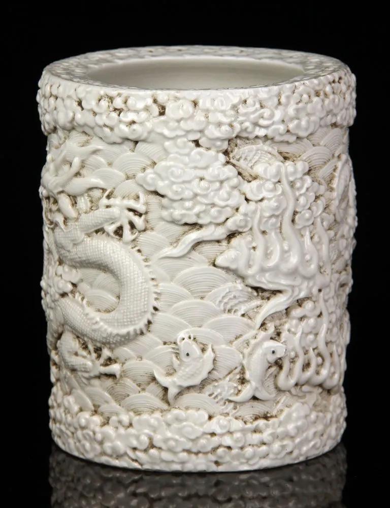 Chinese white brush pot carved with dragon and fish (1 of 3)