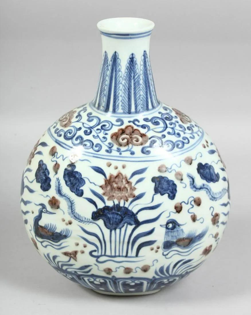 A CHINESE BLUE, WHITE, AND UNDERGLAZE RED PORCELAIN MOON FLASK (1 of 7)