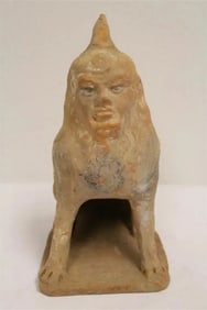 A rare possible Han pottery sculpture of beast with human face
