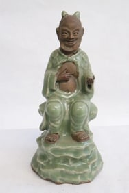 Chinese celadon sculpture of deity