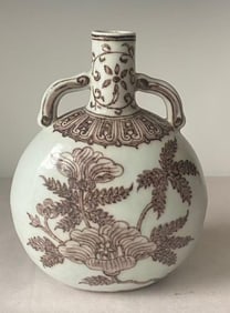 A Chinese Ming Dynasty Xuande period style underglaze red porcelain double-eared flat bottle with