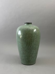 An official kiln plum vase with an inscription in the Qianlong style on the bottom.