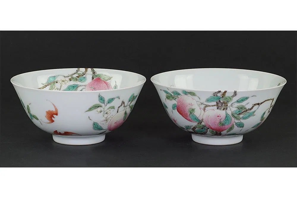 A Pair of Chinese Qing Dynasty Yongzheng period mark Famille Rose Porcelain Bowls: A Pair of Chinese Qing Dynasty Yongzheng period mark Famille Rose Porcelain Bowls. With slightly flared rims and decorated with peaches and bats, bearing underglaze blue six-character Yongzheng marks