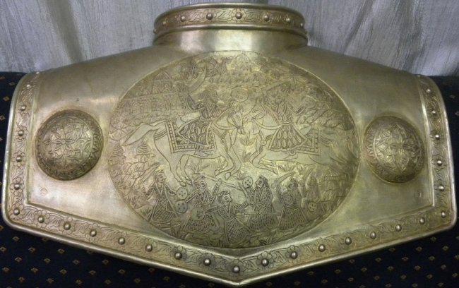 INDO PERSIAN WARRIOR CHEST CUIRASS BRASS ELEPHANT FIG: CHEST ARMOR CUIRASS INDIAN DECCAN CHEST ARMOR CUIRASS HERO KING ON HORSE FIGS. WITH HIS SOLDIERS. THE APPLIED STEEL SILVER PLATED BORDER WITH SEMICIRCULAR NOTCH FOR NECK. MAKE : HAND MADE HAND HAMMERE