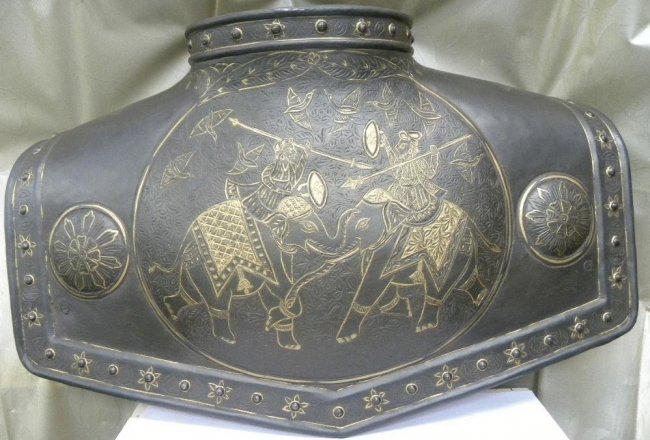 RARE PERSIAN CUIRASS 2 KINGS FIGHTING ON ELEPHANT: A rare piece of collection Deccan cuirass. Hand engraved 2 elephant figures with 2 kings sittingon horse fighting with tradition dress and spear and shield. The applied steel border with semi circular
