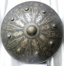 RARE EUROPEAN SHIELD WITH 12 WARRIOR FIGS. & 8 DAGGERS