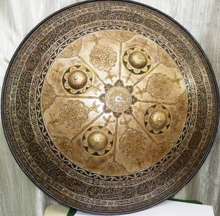 RARE MILITARY WARRIOR SHIELD ARABIC CALLIGRPHY MEDALLIONS: A RARE GEM OF COLLECTION WARRIOR SHIELD WITH HAND ENGRAVING OF ARABIC CALLIGRAPHY AND MEDALLIONS. Ornate Indo Persian convex form circular warrior shield Arabic inscription at bottom rim. Made of