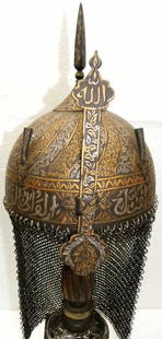 UNUSUAL RARE PERSIAN MILTARY WARRIOR HELMET ARABIC INSCRPTON: UNUSUAL RARE PERSIAN MILITARY WARRIOR HELMET ARABIC INSCRPTONAMAZING PERSIAN WARRIOR HELMET WITH VINE BAND AND DENSE FLOWERING.Province : Indo Persian. Documented : Documented in authentic war