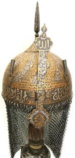 ARMOR TURKSIH WARRIOR HELMET (KULAH KHUD) ARABIC INSCRIPTION SURFACE VINE BAND DENSE FLORING: Province : Turkish.Made : Hand forged steel , hand hammered and hand chiseled , skull made in one piece , the riveted crown Plate with screw mounted, quadrangular spike.Documented : Documented in auth