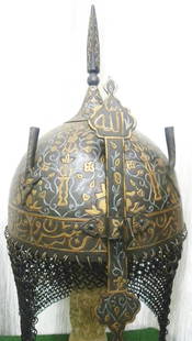 ARMOUR PERSIAN WARRIOR HELMET ( KHULA KHUD ) ARABIC INSCRIPTION SKULL LAVISH FLOWER MOTIFS: RARE STUNNING ARMOUR PERSIAN WARRIOR HELMET. Made : Hand forged steel , hand hammered and hand chiseled , skull made in one piece , the riveted crown Plate with screw mounted, quadrangular spike.Nasal