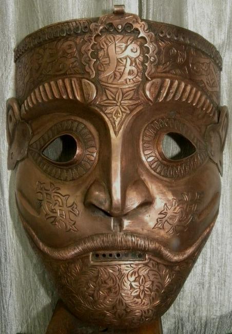 ARMOUR MUGHAL/PERSIAN WARRIOR FACE MASK ARABIC INSCRIPTION LONG MUSTACHE: Province; Persian. Made : Made of steel hand hammered and hand chiseled in one piece of steel & copper plated. Calligraphy : Hand engraved Arabic calligraphy at forehead to invoke Gods power and bless