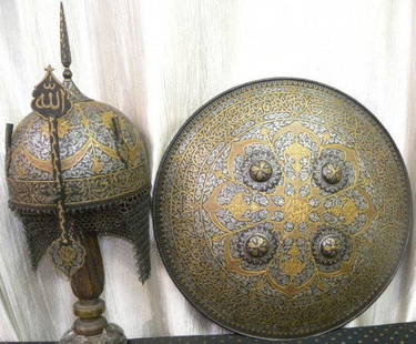 ARMOR TURKISH STYLE WARRIOR HELMET & SHIELD ARABIC CALLIGRPHY RICHLY CHISELD: AROMOR TURKISH STYLE MUSEUM LEVEL WARRIOR HELMET & SHIELD, ARABIC CALLIGRAPHY. SURFACE LAVISHLY chiseled flower motifs decor with depictions and flower motifs on entire surface of set. Made : Set Hand