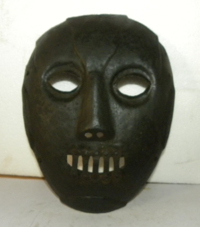 PUNISHMENT FACE COVER SPEAKS WRONG HAND MADE OF STEEL: "Face cover hand made of steel design of mouth locked, was used for person who speaks wrong or bad for anyone in society.After making wear this mask was tied on pole or tree in public place so maximum