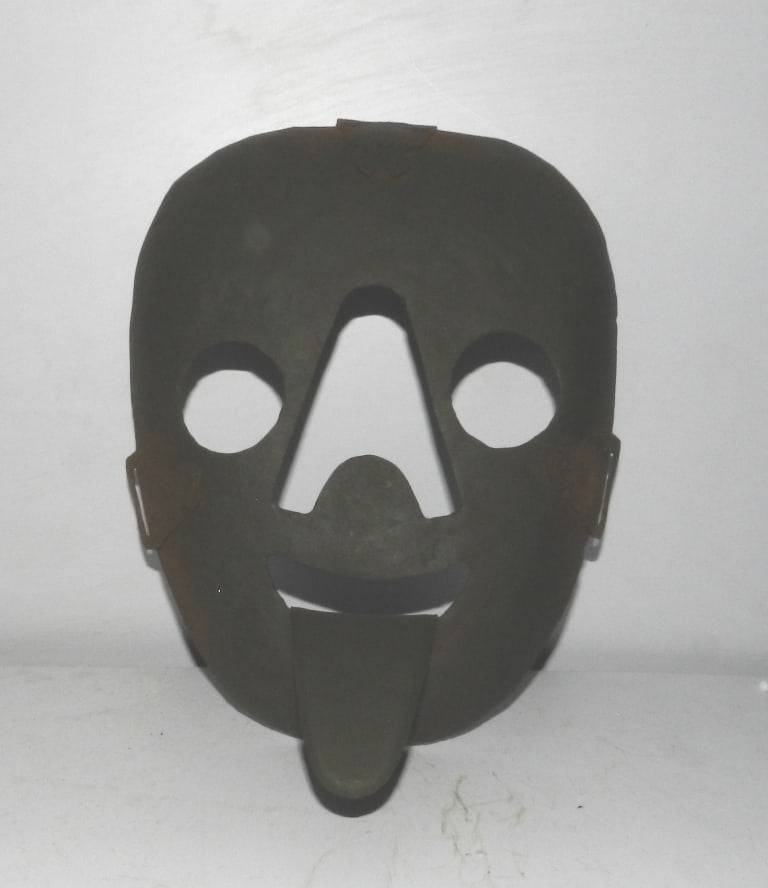 OLD MASK IRON TORTURE SHAME HUMILIATE LONG TONGUE: Old iron mask with long tongue, such were used in older century to punish person who does anything wrong in society. It was made wear to person who do bad / wrong in society and tie on tree or pole wh