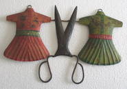 Tailors trade advertisement sign dresses and scissors