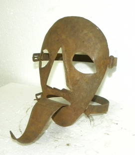 BRANK SCOLDS BRIDLE SHAME MASK WITH LONG TUNG STEEL HUMILIATION IN PUBLIC: Rare steel hand made humiliation mask.Such steel shame masks were used in older times to punish person who does anything wrong in society. The mask has long Tung which would make the person wearing th