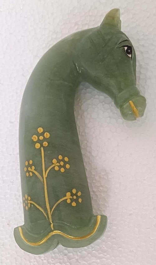 DAGGER HANDLE ASIAN QURTS JADE HORSE FACE SHAPE HAND ENGRAVING PAINTED: DAGGER HANDLE ASIAN QURTS JADE HORSE FACE SHAPE HAND ENGRAVING PAINTEDIncredible Dagger handle , body framed in a horse shape, hand engraving with tendrils and flower motifs & painted. It measures 6 i