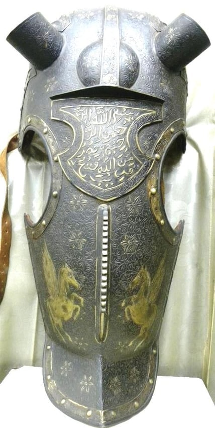 OLD HORSE FACE MASK 2 FLYING HORSE FIGS ENGRAVED & FLOWER MOTIF CALIGRPHY ENGRAVED ROPES TO TIGHT: Incredible VERY OLD iron horse face mask 2 flying horse figs engraved. Made of hand forged steel, hand hammered and chiseled . The horse face mask has brass decoration all over with on fine hand engra