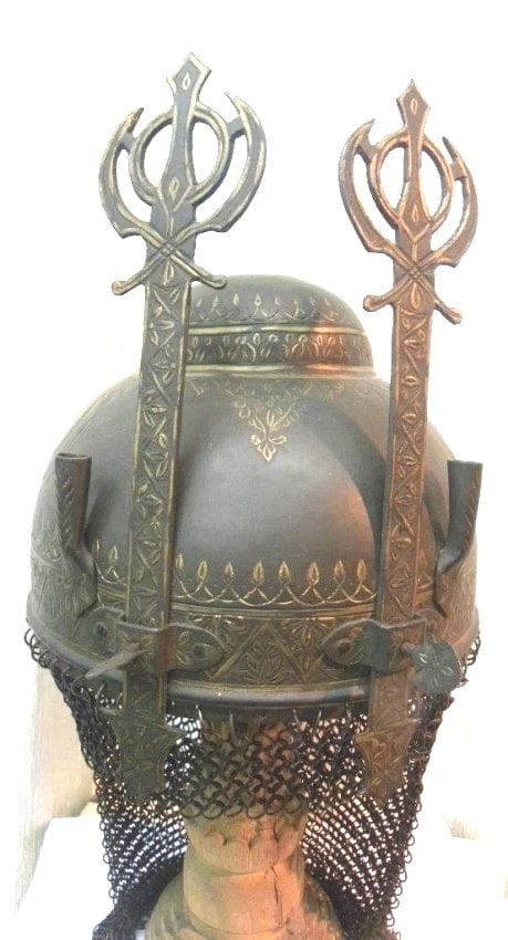 INCREDIBLE SIKH HELMET 2 SIKH HOLY KHANDA SYMBOL NASAL GUARD SKULL KHANDA SYMBOL CHISELED: Gem of collection Sikh warrior helmet two Sikh Religious symbolic .The Sikh soldiers used oval helmets so that their long hairs knot could hang over easily in the bump at the top of helmet. Make : Han