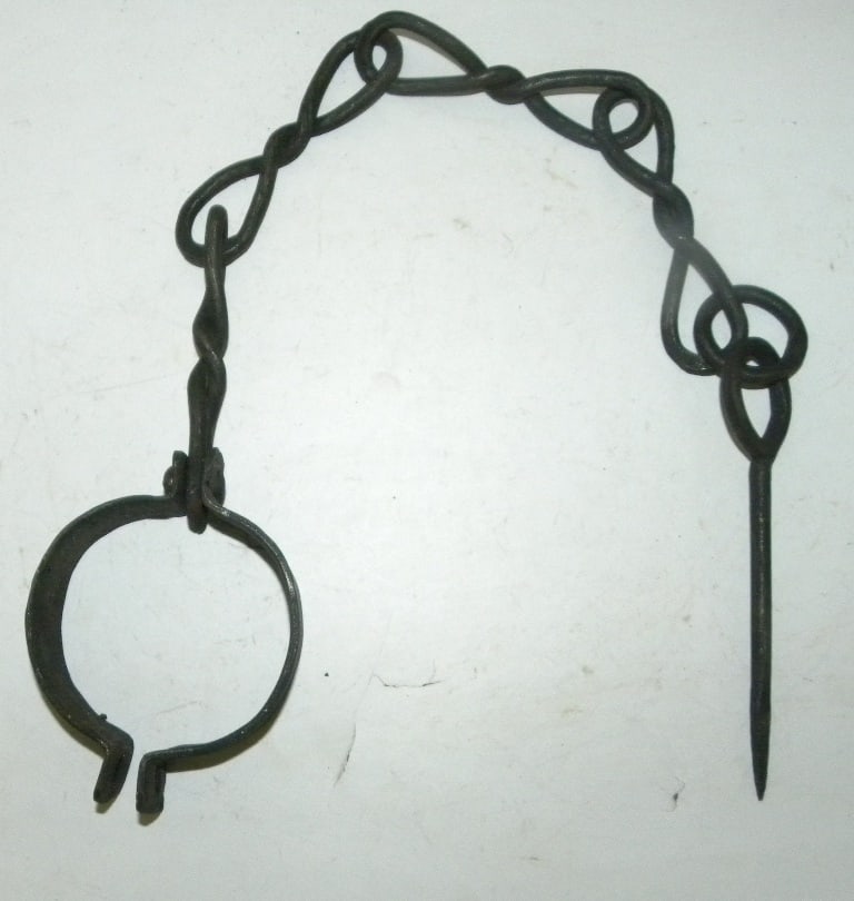 OLD CHAIN TWISTED HAND FORGED WITH NAIL TO TIE PRISONER IN JAIL: Old hand forged iron chain (twisted) to tie prisoner in jail. This one side has nail to fix on wall and other side to tie wrist.This will not allow prisoner to run away.I have described with best of m