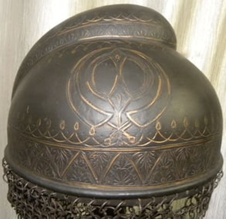 ANCIENT SIKH INCREDIBLE HELMET BUMP TOP 4 SYMBOLIC KHAND ENGRAVED TO FIT HAIR KNOT OF SIKH WARRIOR: Incredible Sikh helmet. Make : Made of Hand forged steel , hand hammered and hand chiseled engraving. The Sikh soldiers used oval helmets with bump so that their long hairs knot could fit easily in th