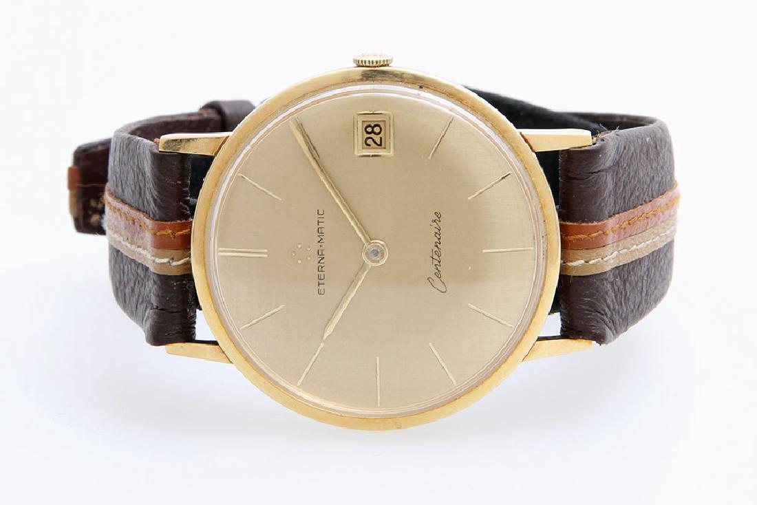 ETERNA Herrenuhr "Centenaire", GG 18K.: 1950/60er Jahre. Automatic-Werk, Cal. 1439U. Werk-Nr. 4447720. GehÃ¤use-Nr. 4127050. Lederband (getragen, nicht original). Gebrauchsspuren an GehÃ¤use u. Glas.