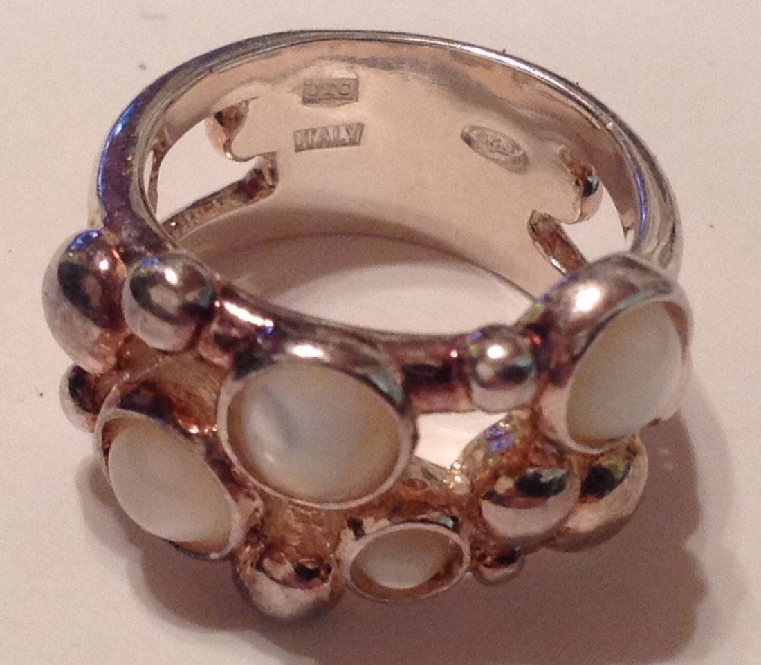 Estate Sterling Silver gemstone signed UTC ring (S): Estate items. Marked UTC 925. Sterling. Tested. Abalone butterfly ring. Size 4.75.