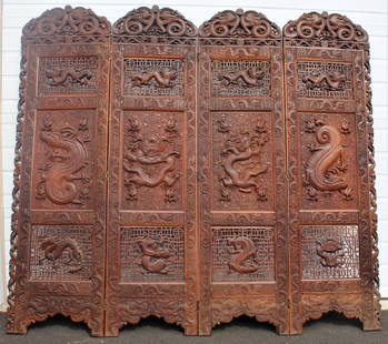 Early 1900 Chinese Wooden Screen: A four-panel hardwood screen deeply carved with rampant dragons. Chinese, circa 1900. Each panel is 21 inches. Title: Early 1900 Chinese Screen. Medium: Wood. Size: 72 X 84. Artist: Chinese. 