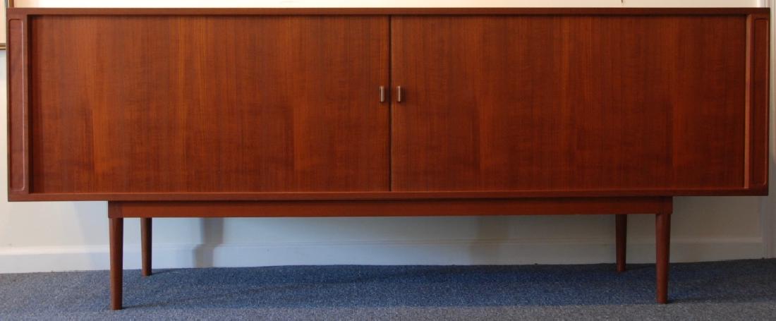 Jens H. Quistgaard Danish Tambour Credenza: Levig Design (Manufactured). Danish Modern Tambour Door Credenza designed by Jens H. Quistgaard 1966 stamp on bottom. It has two tambour doors that open to three sections. The middle sections has five