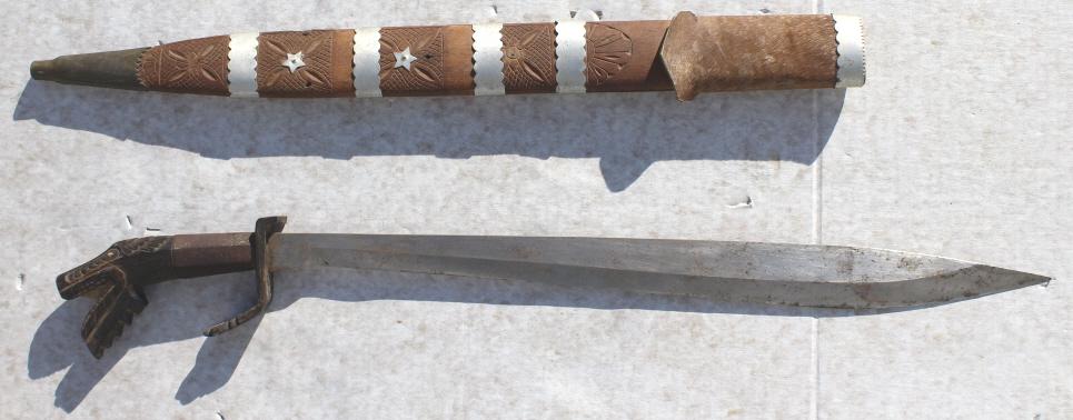 Philippines Sword: Philippines Sword. circa 1940's. Title: Philippines Machete. Medium: metal, wood. Size: 4 x 29 x .75 in. Artist: Philipines. Unframed.