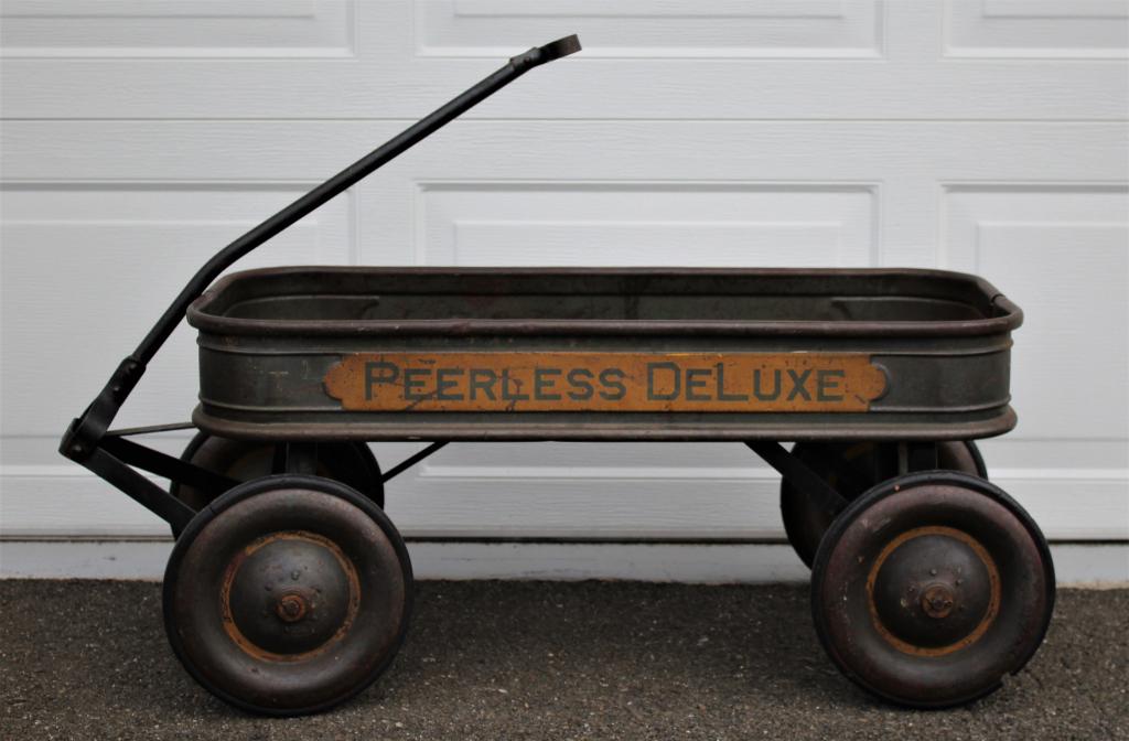 Peerless Deluxe Wagon: Peerless Deluxe Wagon. Old wagon in very good condition. Handle measures 26. Height with handle up is 36".". Title: Peerless Deluxe Wagon. Medium: Metal. Size: 15 X 15 X 36 in. Artist: Peerless Deluxe