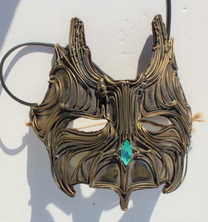 Mask: Mask. Signed 2009 Mixed media with green jewel. Title: Mask. Medium: Mixed Media. Size: 8 X 6.75 X 4.5 in. Artist: Robert Alan Hyden. Unframed.