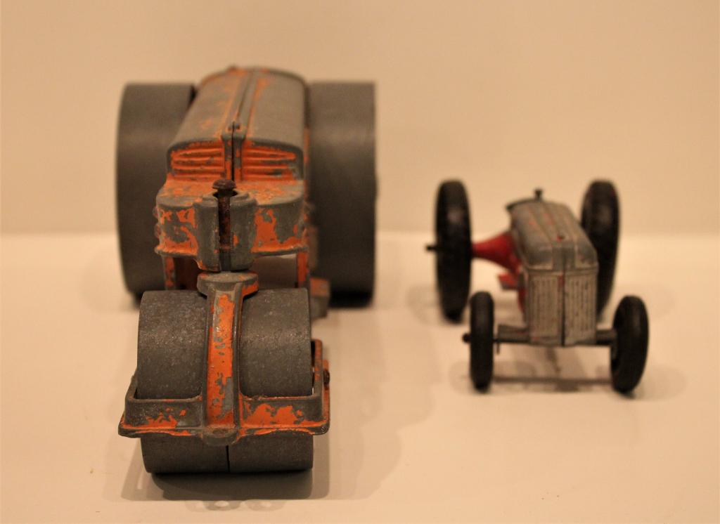 Metal toys Steam roller and tractor: Metal toys Steam roller and tractor. Title: Metal toys Steam roller and tractor. Medium: Metal. Size: 10 X 4 X 4 in. Unframed.