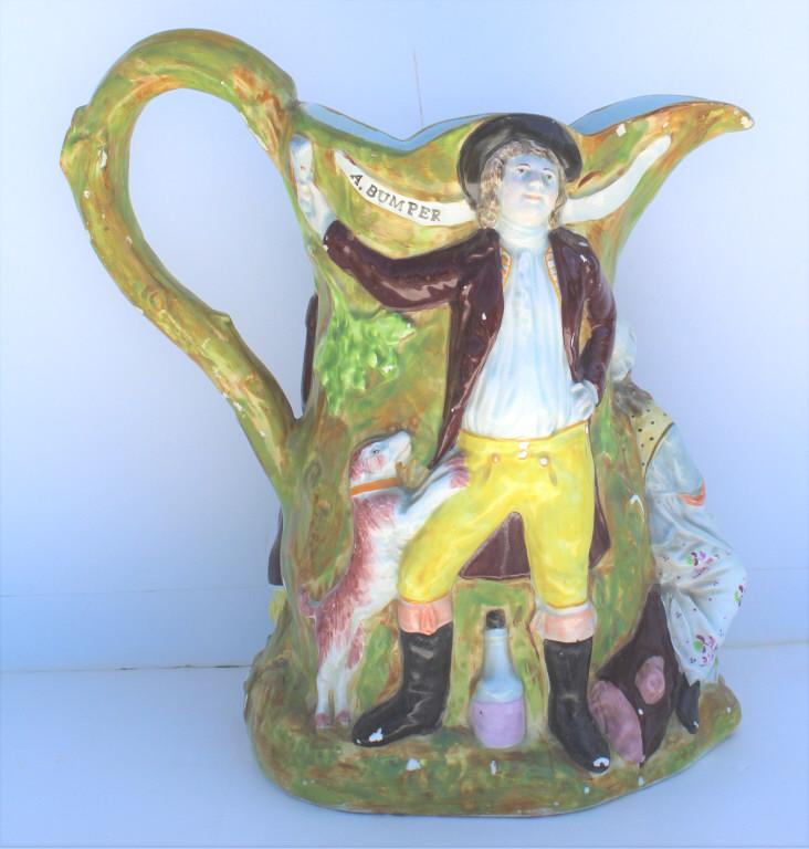 ENGLISH STAFFORDSHIRE PEARL/ PRATTWARE "FAIR HEBE. Staffordshire Pearlware Fair Hebe Figural: ENGLISH STAFFORDSHIRE PEARL/ PRATTWARE "FAIR HEBE. Staffordshire Pearlware Fair Hebe Figural Pitcher. The pitcher with a faux wood bark finish and branch form handle, continuously decorated, depicting