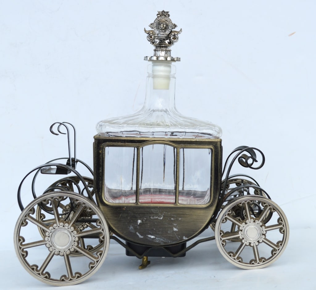 Japanese crystal whiskey decanter music box: Japanese crystal whiskey decanter music box. Title: Japanese crystal whiskey decanter musicx. Medium: Glass/Metal. Size: 10 x 10 x 5 in. Unframed.