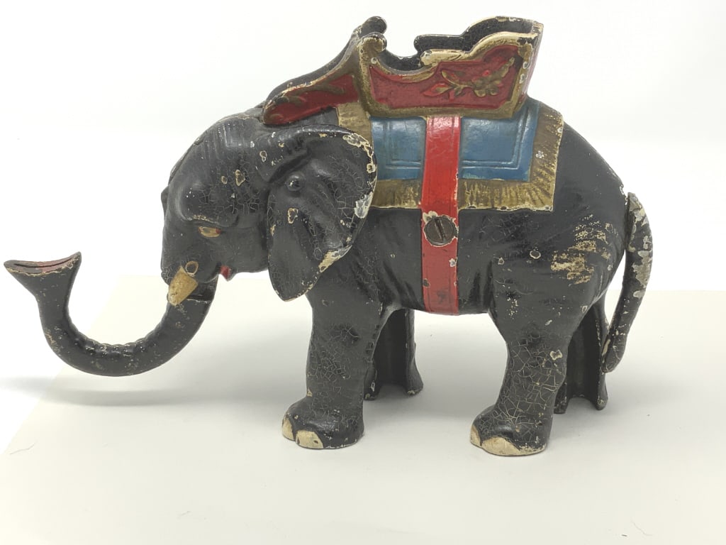 Elephant mechanical bank, cast iron: Elephant mechanical bank, cast iron. Title: Elephant mechanical bank. Medium: Cast iron. Size: 5.50 x 8.50 x 3 in.