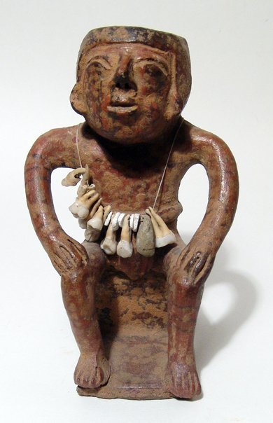 Narino male seated man with necklace of teeth: An attractive Narino male seated man with necklace of teeth, Colombia, Capuli Complex, AD 850 - 1500, he is depicted seated on a square chair and wears a loin cloth which extends from his girdle, his 