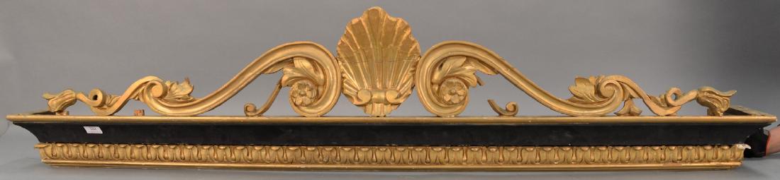 Set of four gilt and black painted valances having: Set of four gilt and black painted valances having center carved shell flanked by scroll and leaf design.
