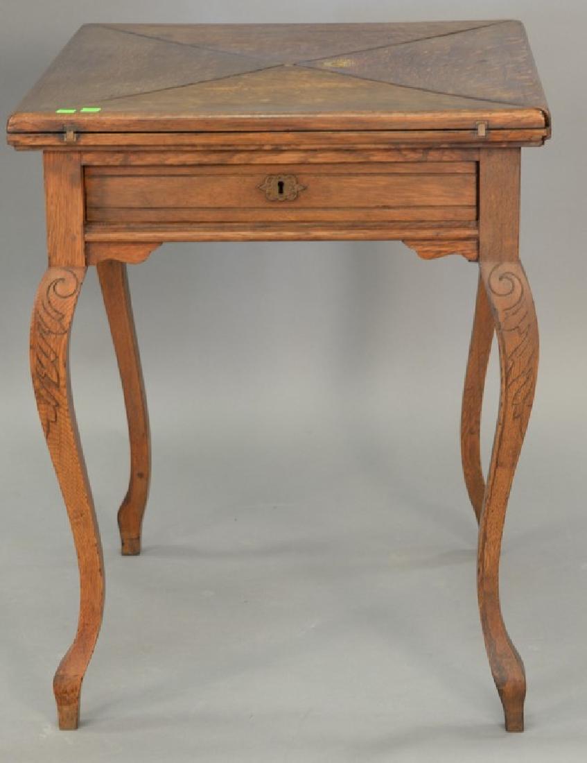 Oak one drawer game table with folding triangle top. (1 of 6)