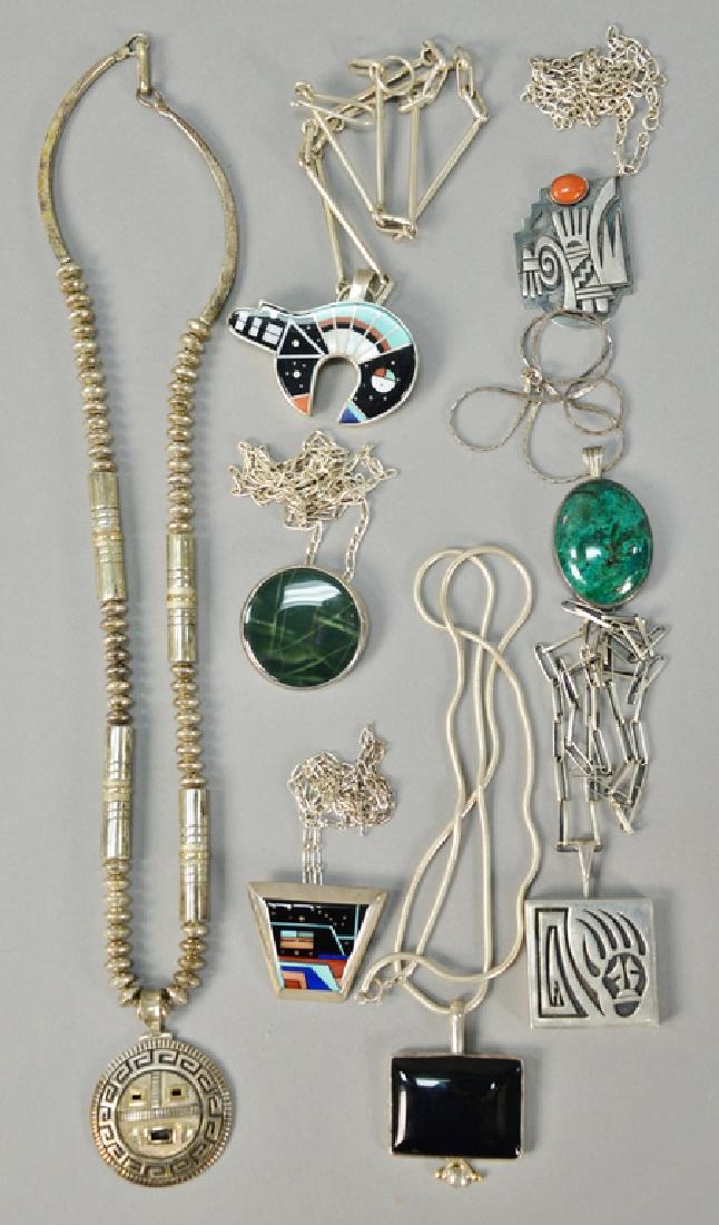 Eight necklaces, all with pendants, six with stones. (1 of 4)