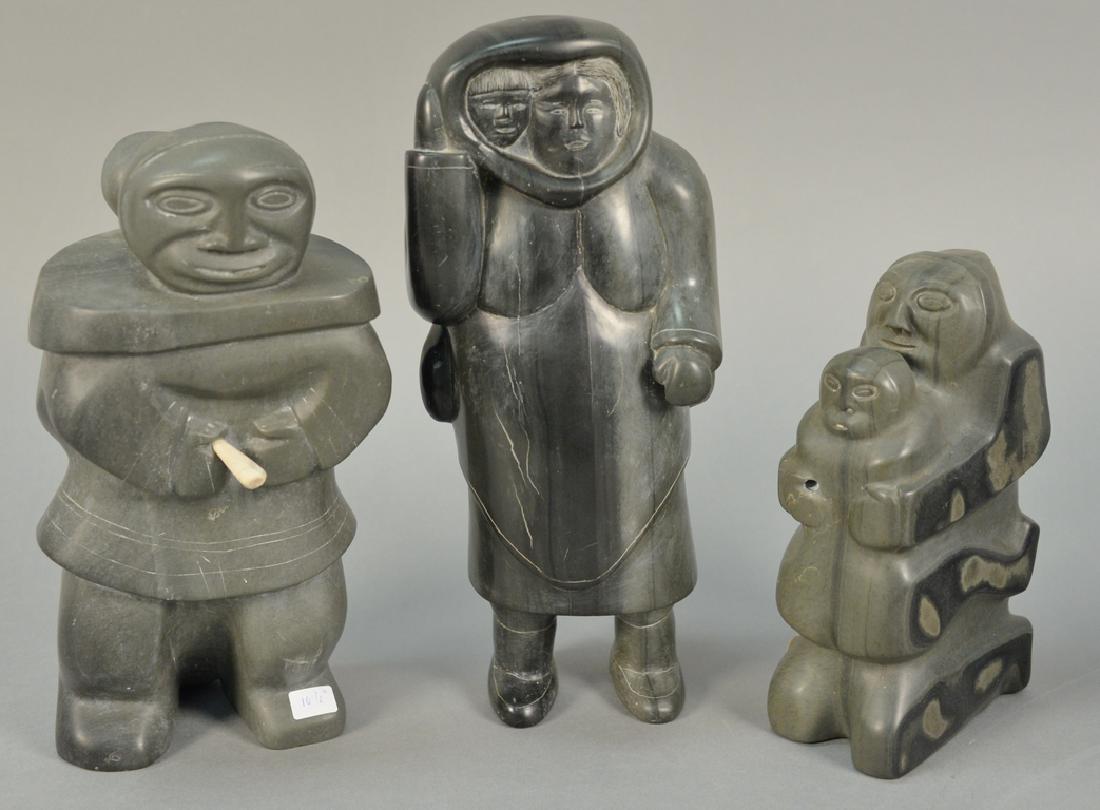 Three large Inuit Eskimo carvings to include Gina Sala: Three large Inuit Eskimo carvings to include Gina Sala Kuujjuaraapik dark green serpentine Woman/Child (11 1/2"), unknown artist Kuujjuarapik dark green soapstone Standing Mother/Child (Provenance: Wa