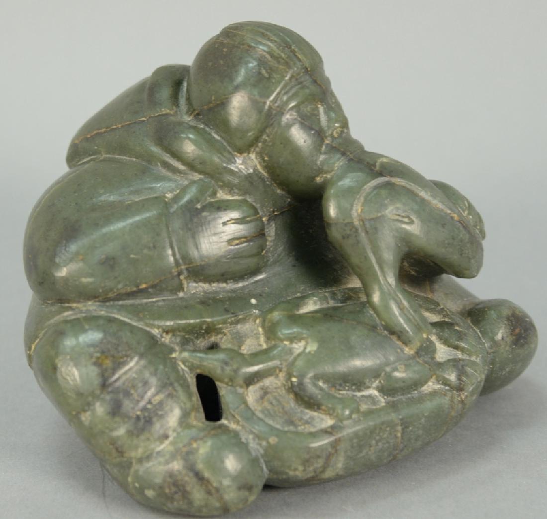 Inuit Eskimo carving Simeonie Weetaluktuk (1921): Inuit Eskimo carving Simeonie Weetaluktuk (1921) Inukjuak (Port Harrison) green serpentine Hunter Blowing Avatak. 4" x 5 1/4" x 5 1/4". Provenance: Waddington's Fall 2011 Auction