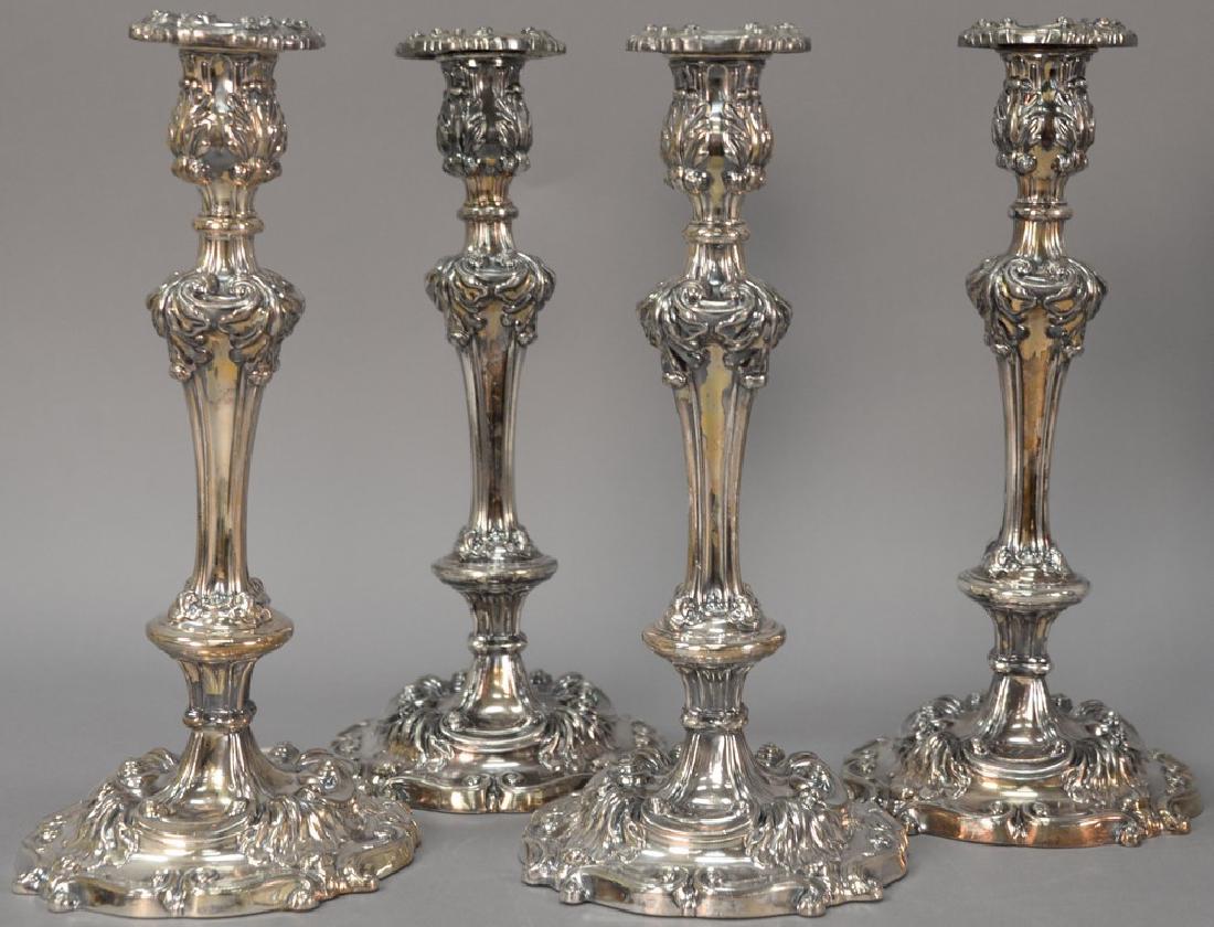 Set of four silverplated candlesticks. ht. 13 1/2in. (1 of 5)