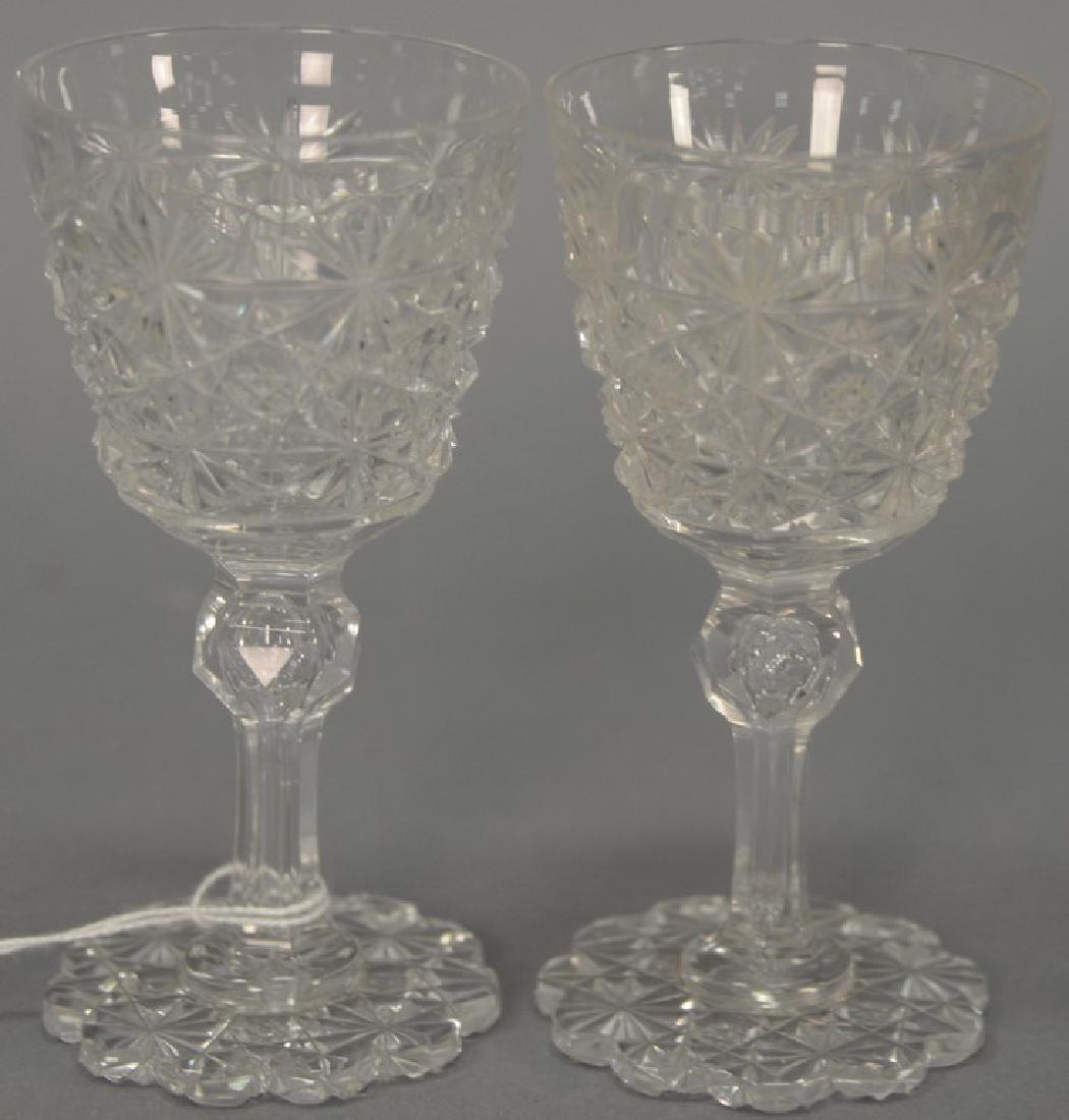 Set of eight cut glass stems with petal bases (chips).: Set of eight cut glass stems with petal bases (chips). ht. 4 1/2in.