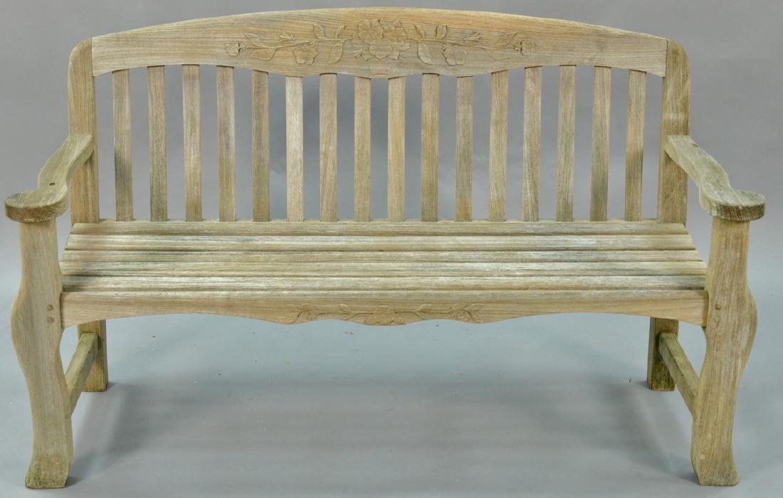 Teak bench with arms and flower carved back, signed (1 of 4)