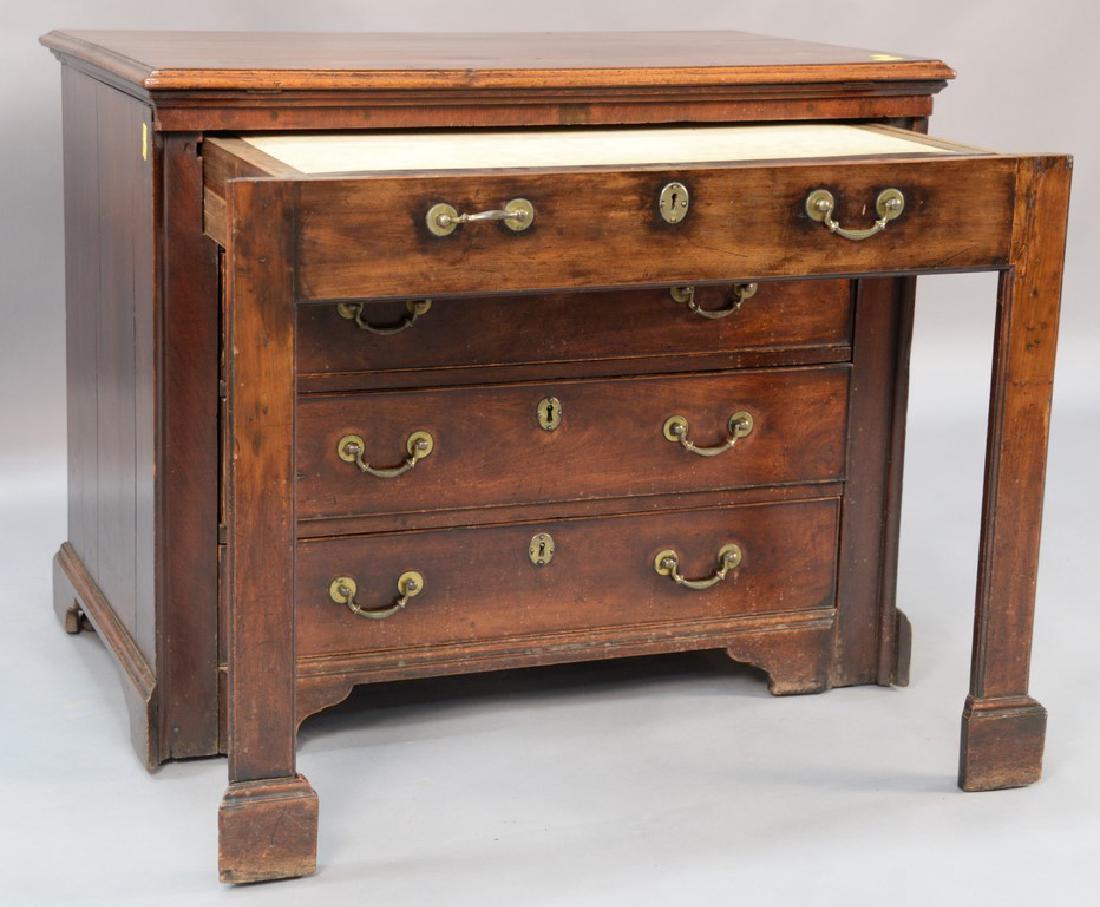 George III walnut and walnut veneered architect's: George III walnut and walnut veneered architect's table, late 18th century, the rectangular molded top hinged to elevate above a case with a frontal frame pulling forward to reveal a tooled leather in