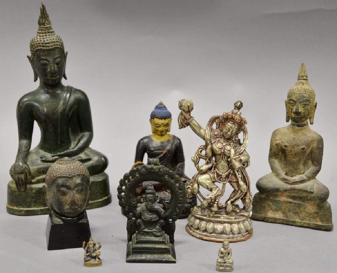 Group of eight Asian and Archaic pieces to include two: Group of eight Asian and Archaic pieces to include two copper or bronze alloy figures of Buddha along with remnant of an archaic Buddha head, an early carved wooden figure of a Tibetan Buddha figure, 