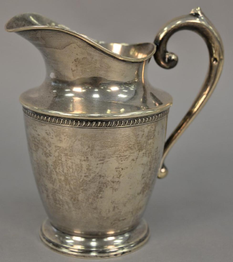 Sterling silver pitcher. ht. 8 3/4in., 19.64 t oz. (1 of 5)